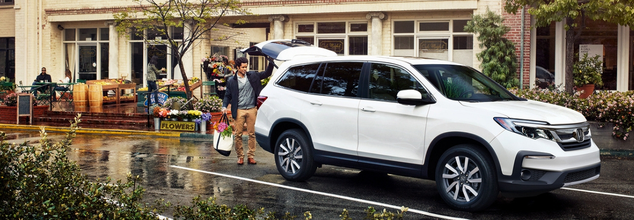 Man loading back of 2019 Honda Pilot